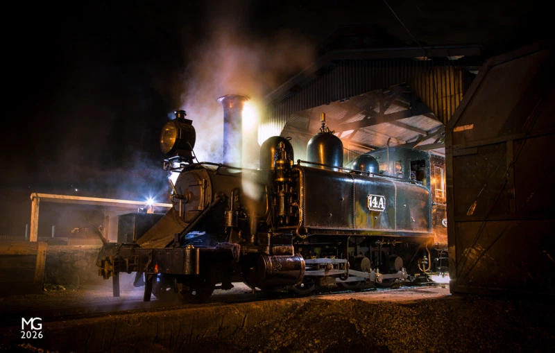 Night light As the fire is dropped on 14A steam and smoke gather in the still night air, shrouding the youngest surviving NA class locomotive. 14A had just returned from Nobelius Siding with one of Puffing Billy Railway's regular dinner trains.